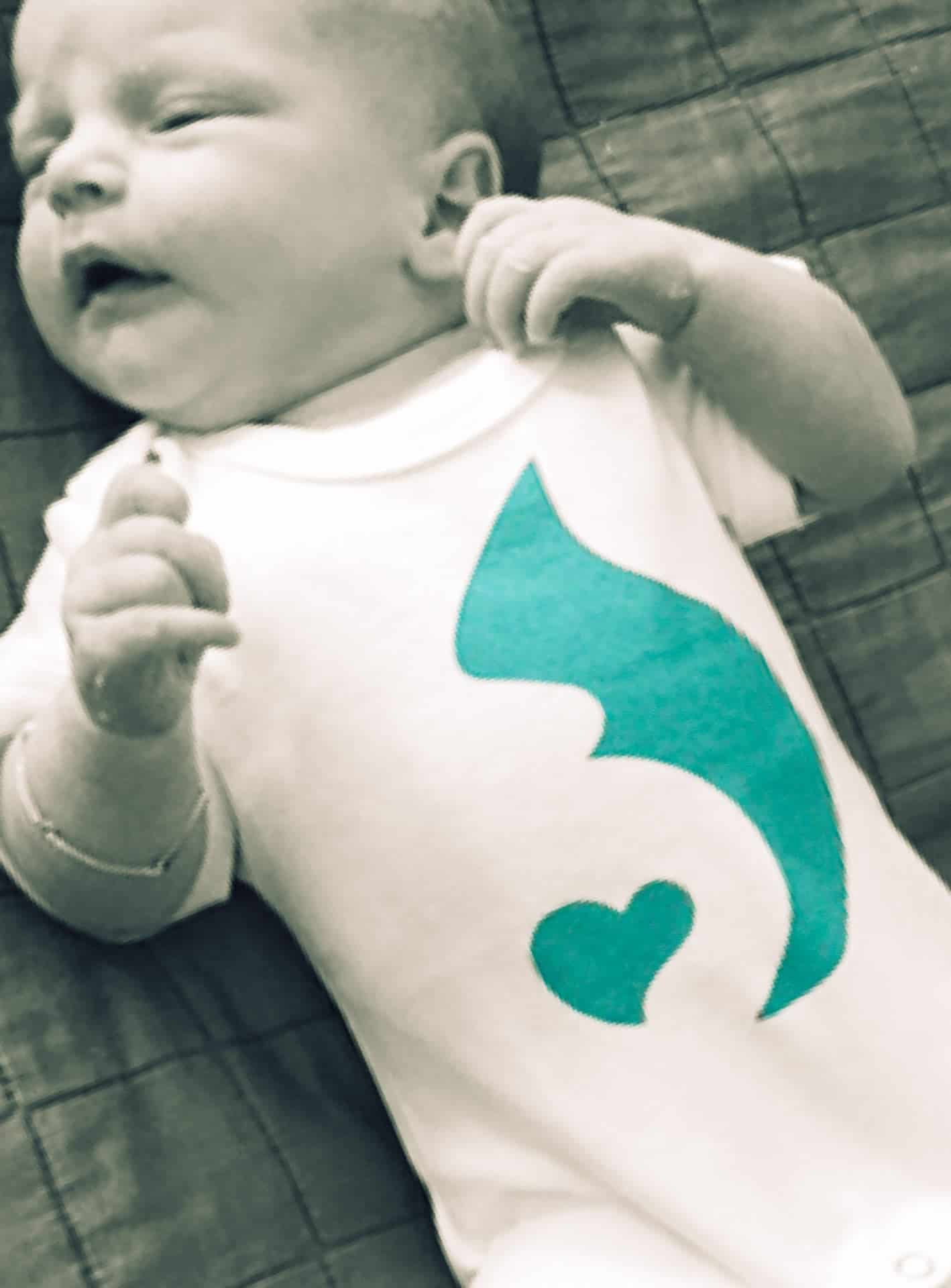 Baby girl with the birthpools logo.